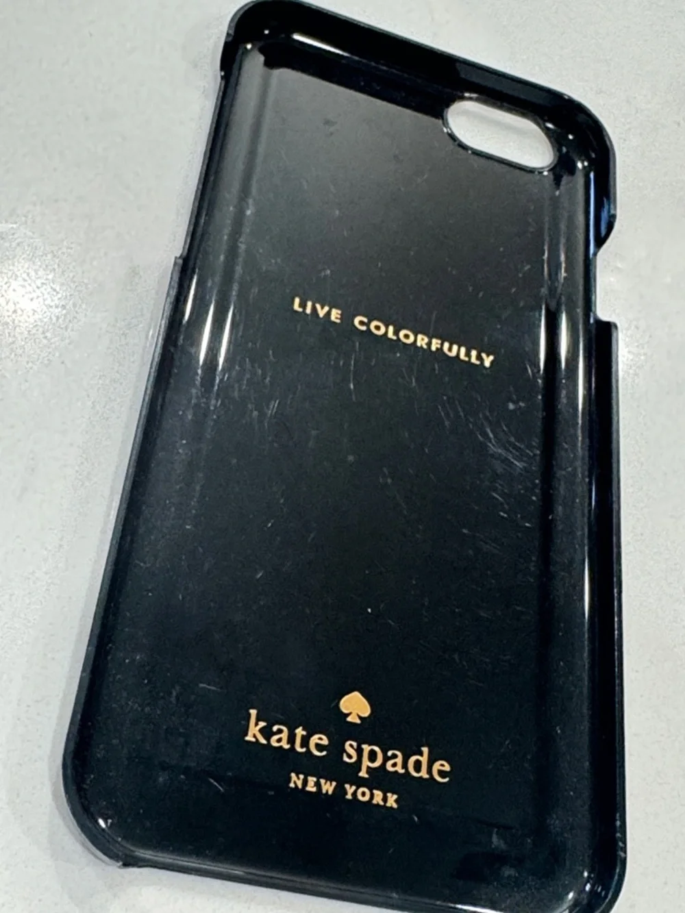 kate spade cream phone case with black grid and gold foil script